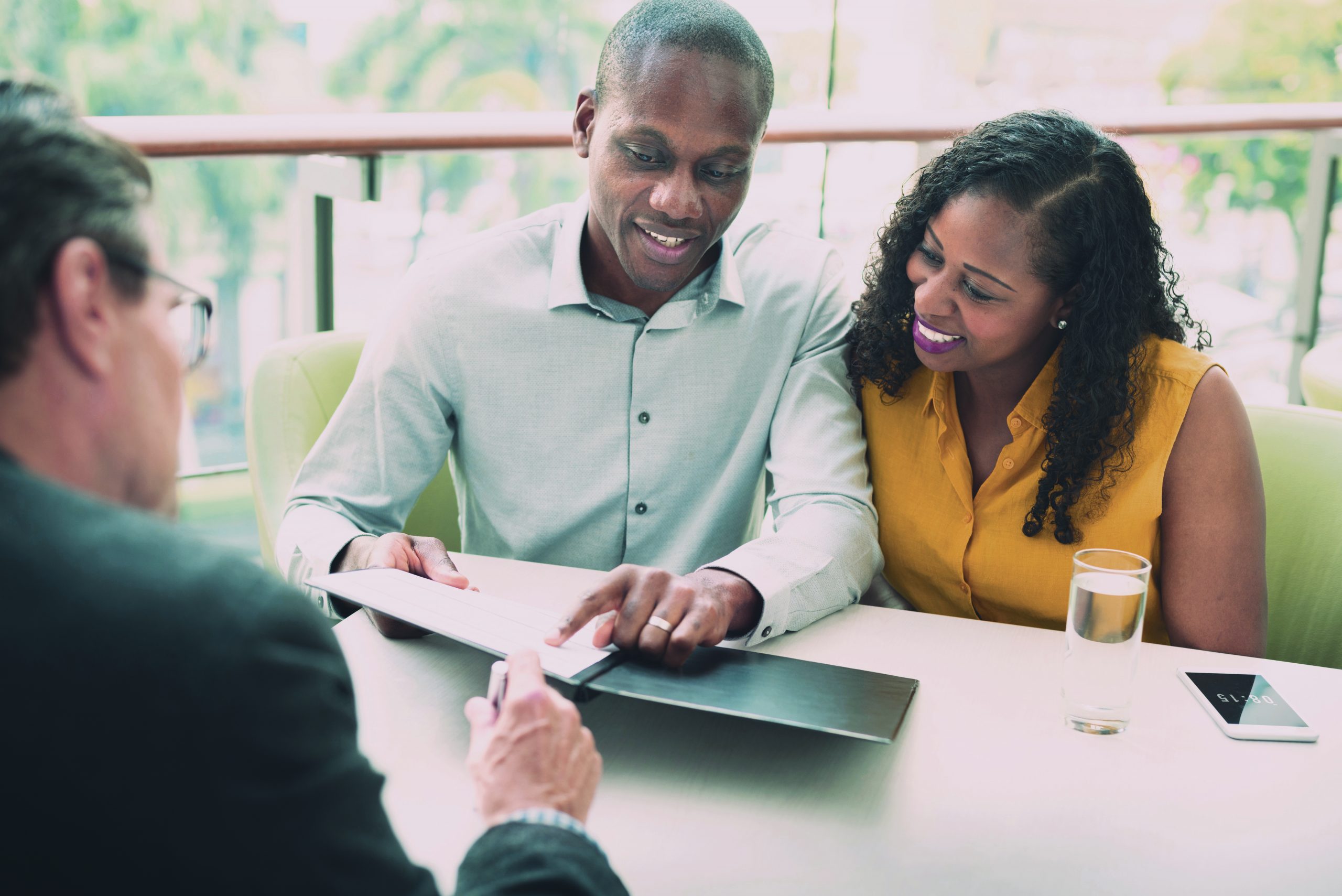 real estate - agent and clients going through contract